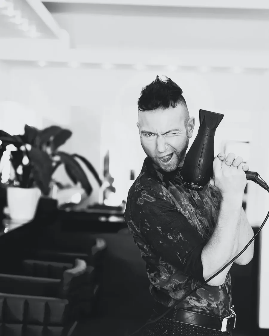 Ryan with a blow-dryer in the salon